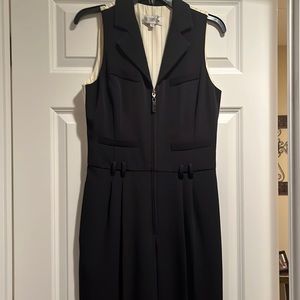 In Transit black pantsuit.  Front zipper.